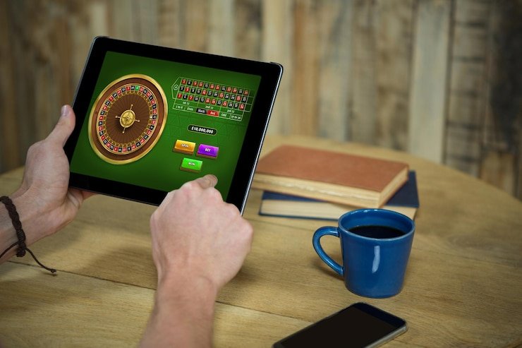 Close-up view of live dealer hands dealing Free Bet Blackjack cards on felt table at bpjs777 slot